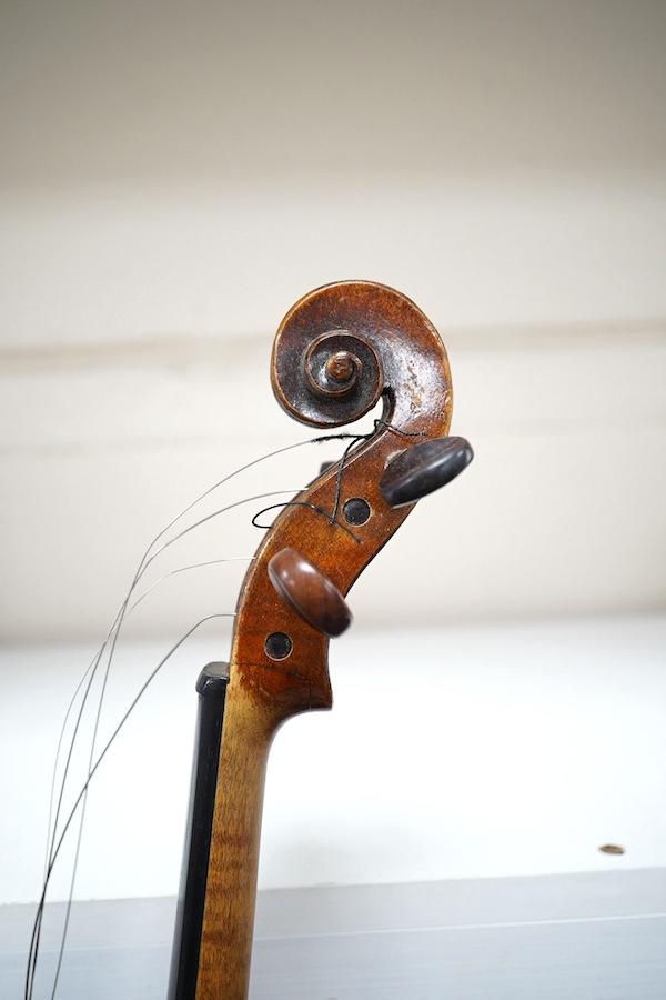 A cased violin, possibly German, body 35.5cm, in a good wooden case with canvas outer cover. Condition - fair